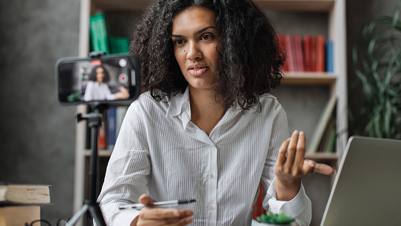 Woman pointing at her laptop