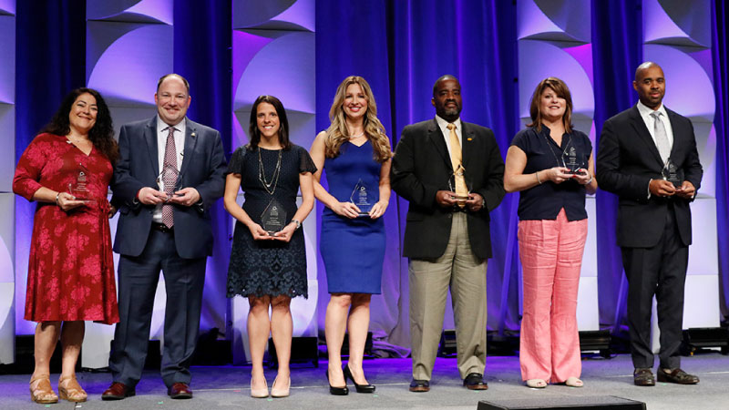 Group of award winners on stage